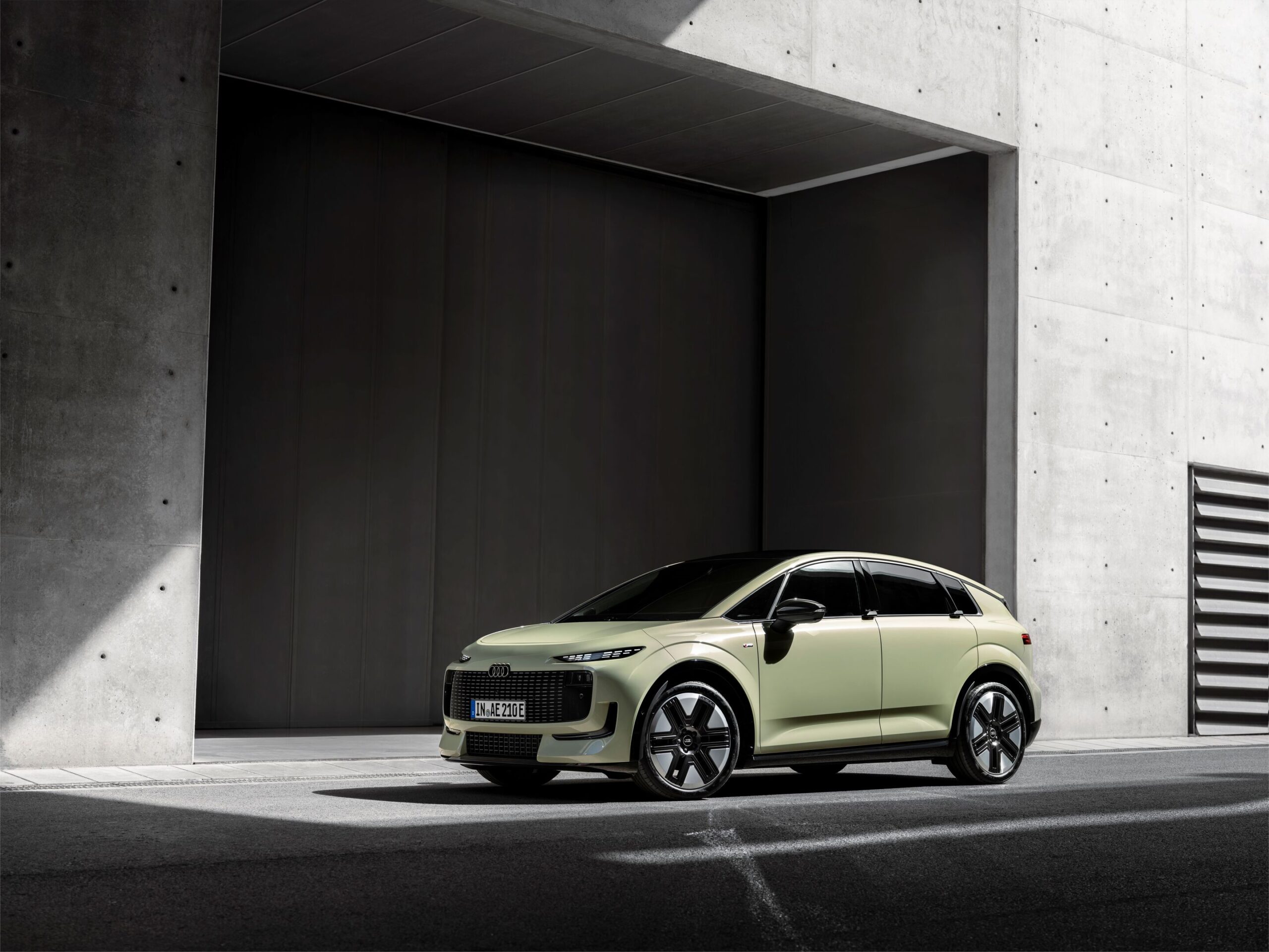 Pistachio green Audi A2 e-tron in a front three-quarter view